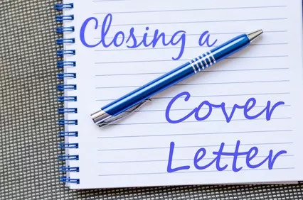 Notepad with blue pen and words written on page "Closing a cover letter"