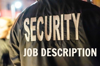 Security guard wearing a black jacket with words 